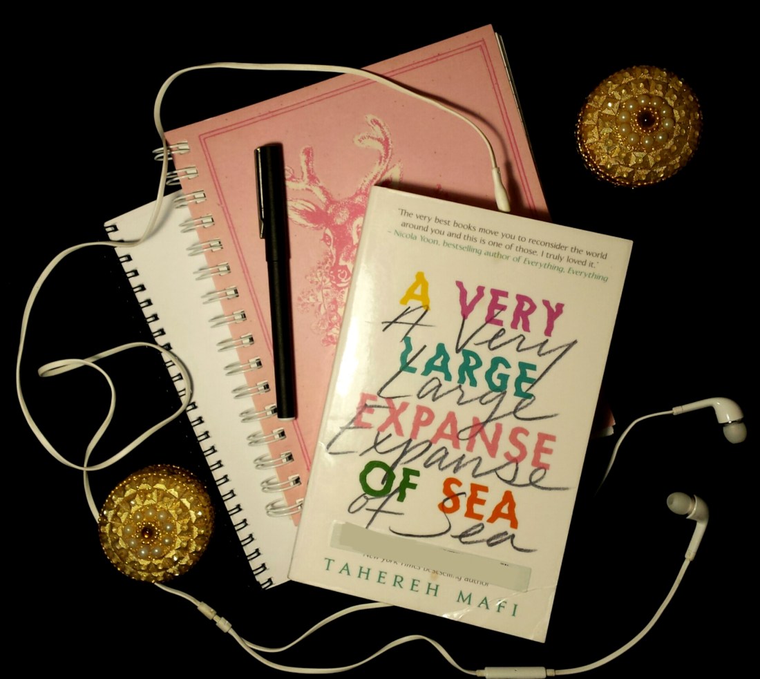 Tahereh Mafi's A Very Large Expanse of Sea book flatlay.